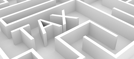 A white maze with TAX spelled out as part of the maze barriers. Scott Nissen can help you navigate your taxes.